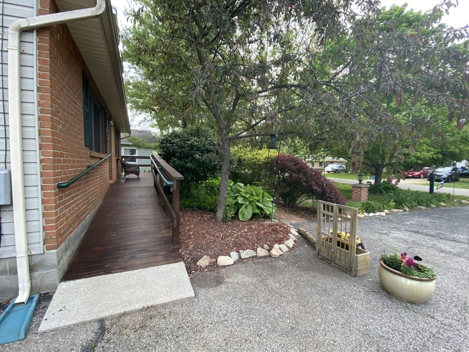 Off street parking and the wrap around porch leading you to a private entrance 