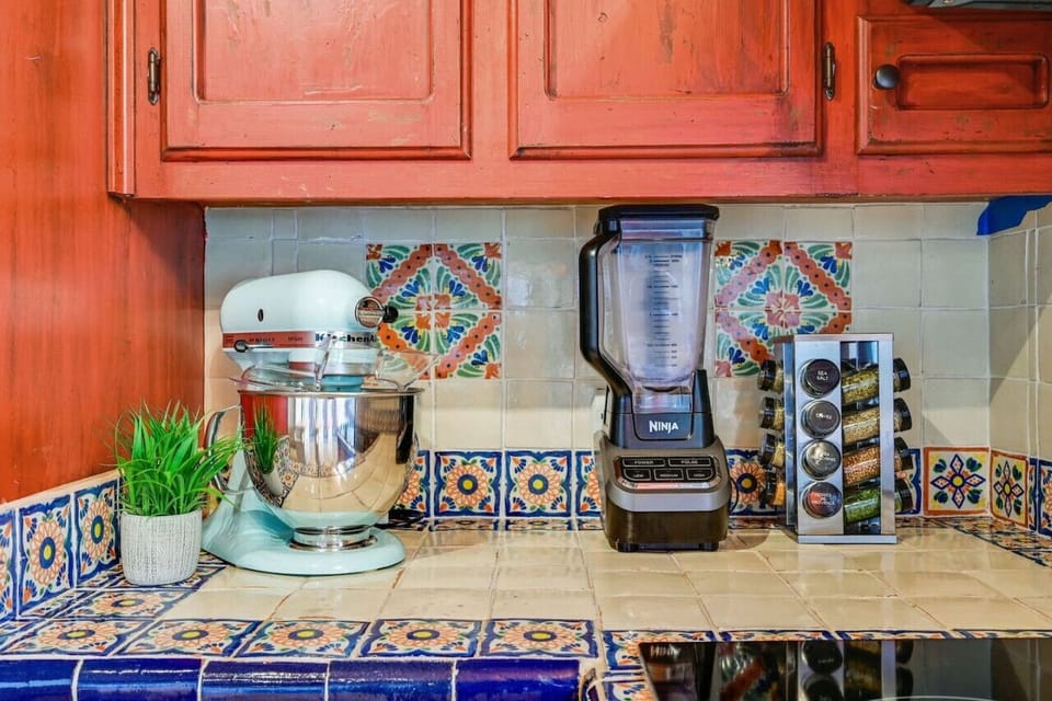 Road Runner Lodge kitchen includes stand mixer, Ninja blender, and spice rack—fully stocked for baking, smoothies, and home‑cooked Hill Country meals.