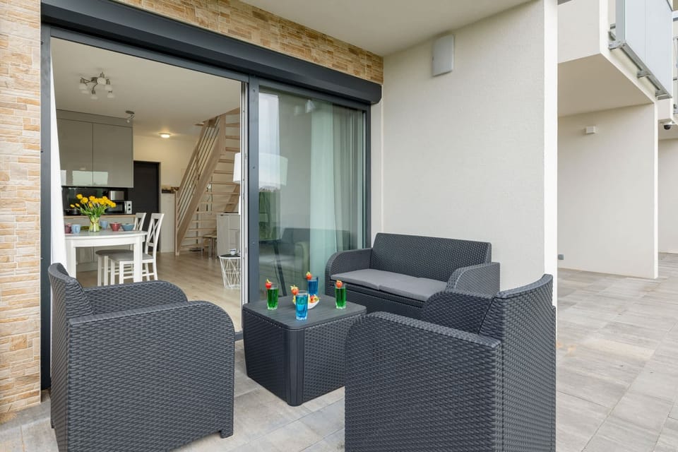 Spacious terrace with outdoor furniture. 