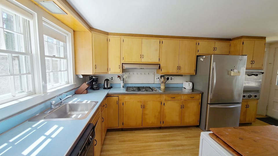 Kitchen with gas cooktop and wall oven