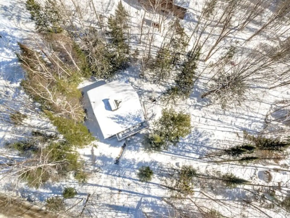 An overhead shot of the chalet and property.