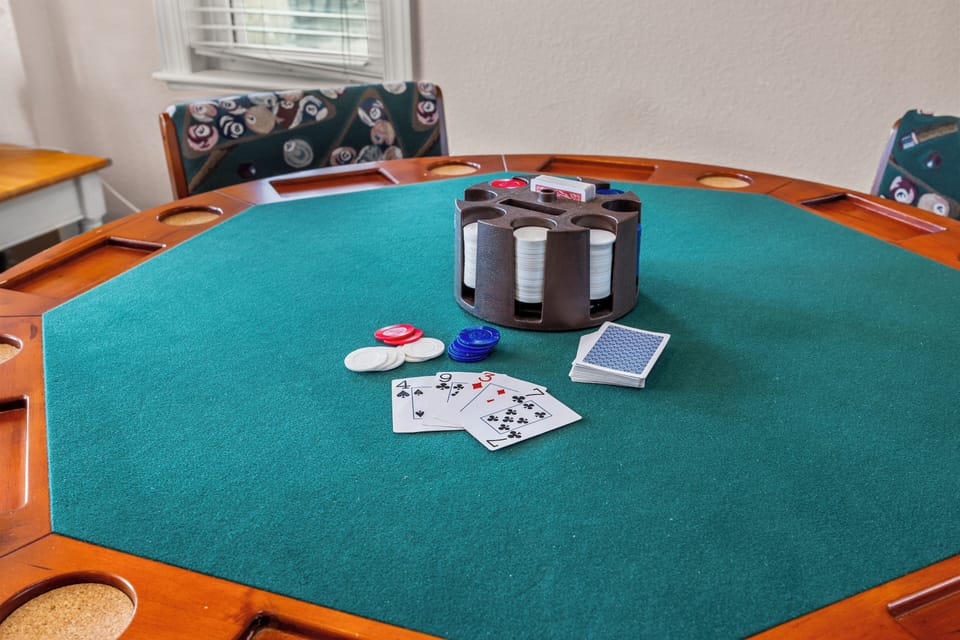 Poker Table - Upon entry to the home, you'll be greeted by the foosball and poker table.
