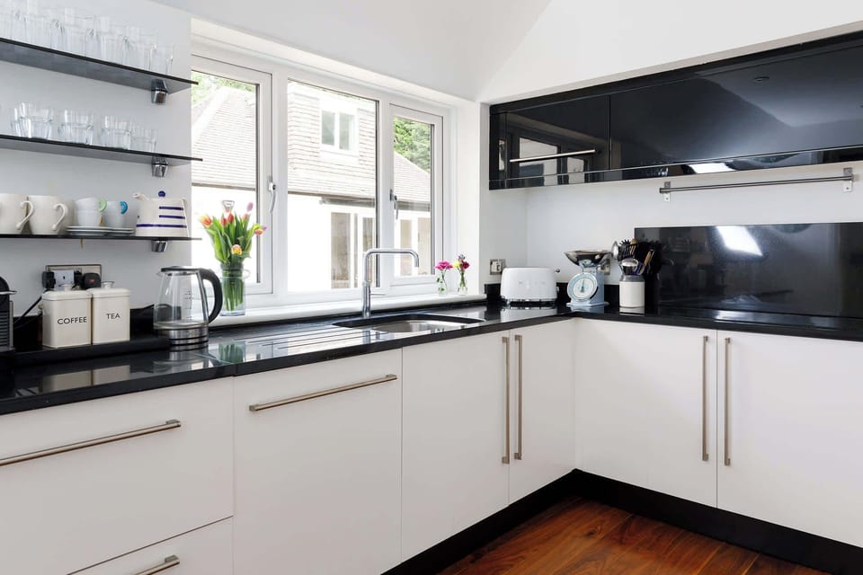 The kitchen has a electric hob, double oven, double fridge and dishwasher.