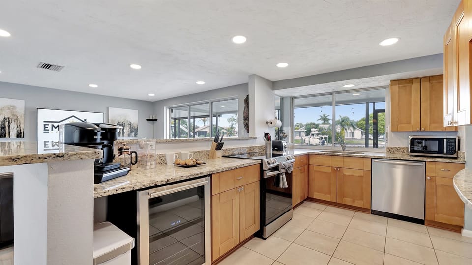 This spacious kitchen features all-new stainless steel appliances, including a refrigerator, stove, oven, microwave, dishwasher, and more!