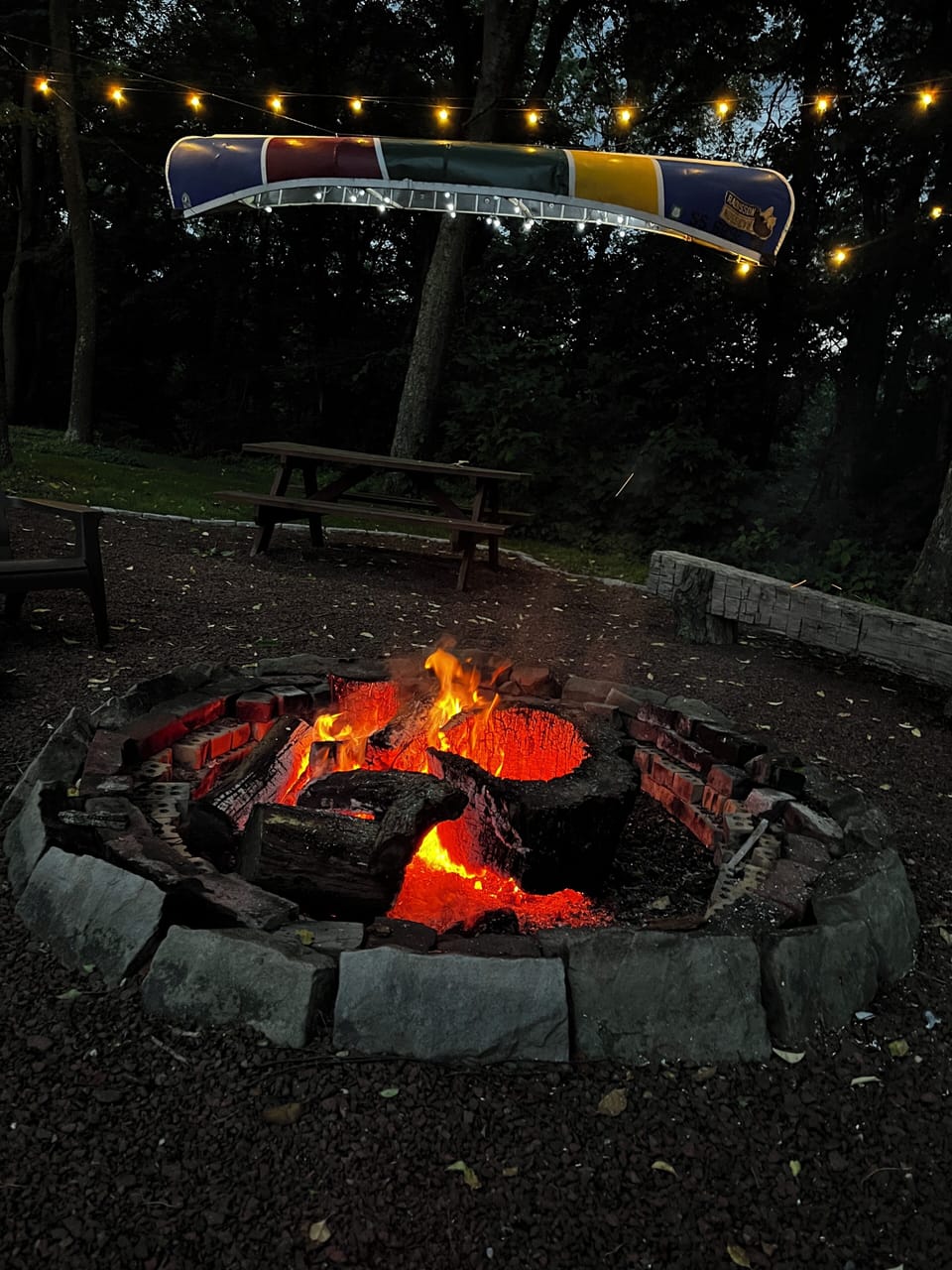 Enjoy an evening under the "Canoe Chandelier" & Firepit.  (Fire wood is provide)