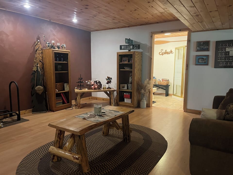 In the game room, there is a couch and futon. 