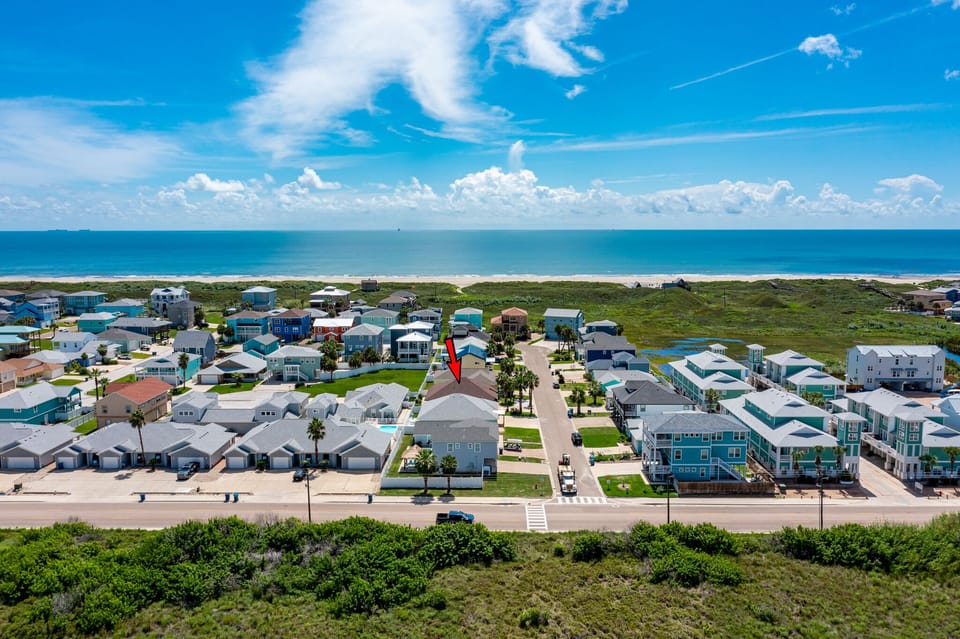 Location! 2 minute drive to having your toes in the sand! 