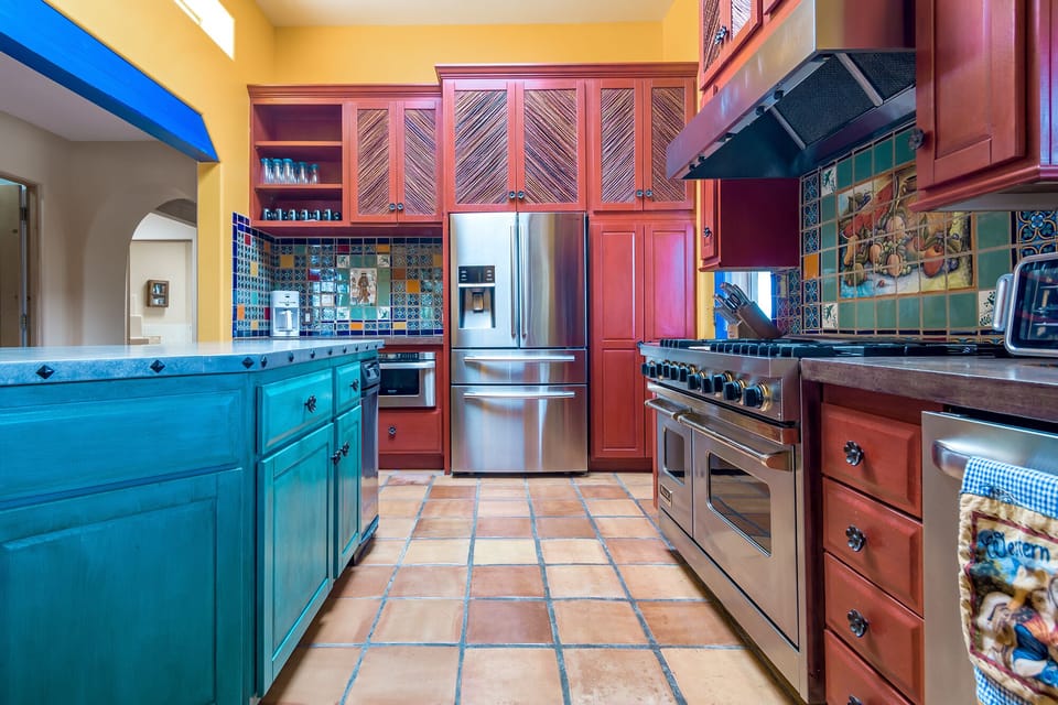Easy to work in, colorful kitchen with plenty of storage. 