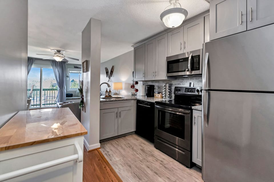 Enjoy preparing a home cooked meal in the fully equipped, open, updated kitchen.