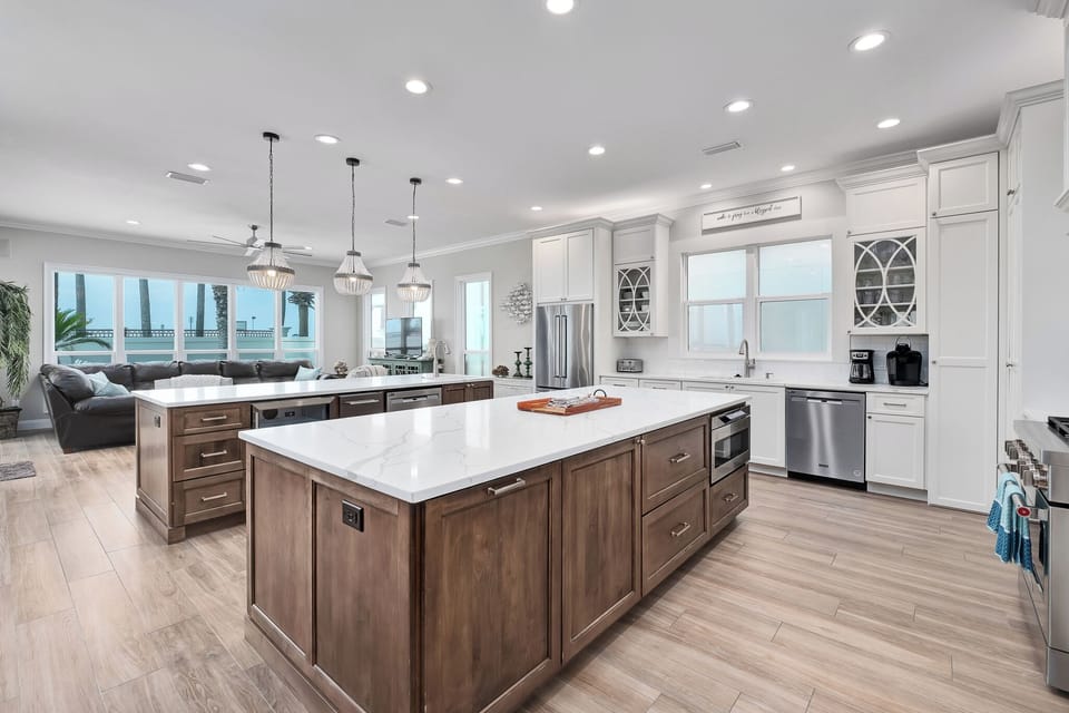 Galley Style Kitchen With Two Serving Islands