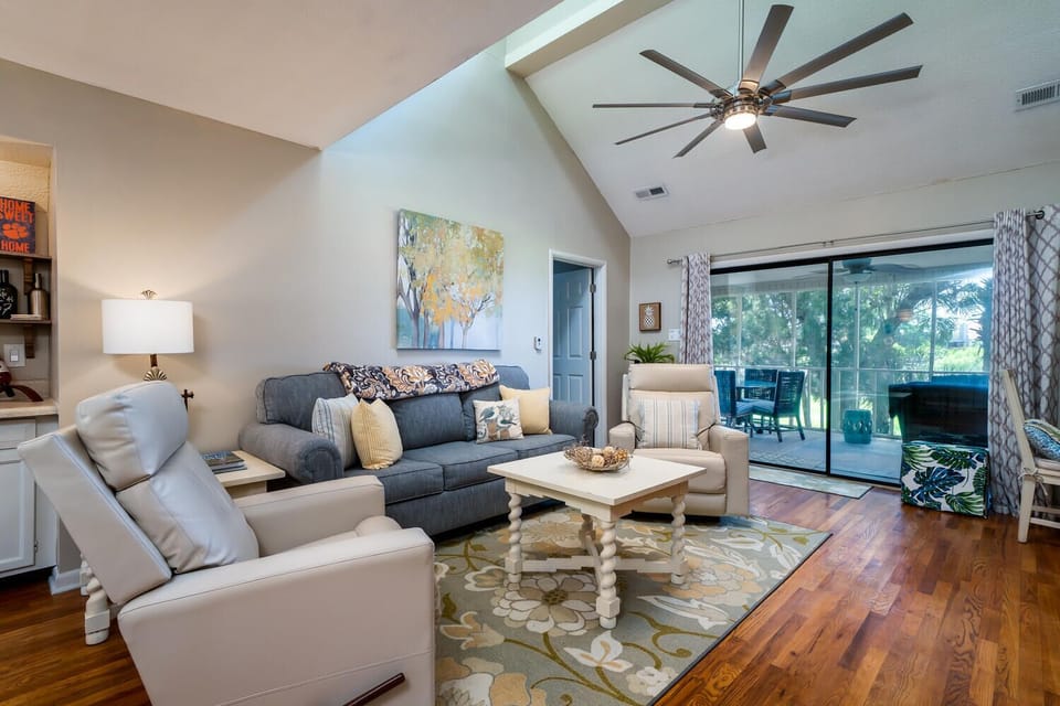 The great room has sliders leading out to the screen porch