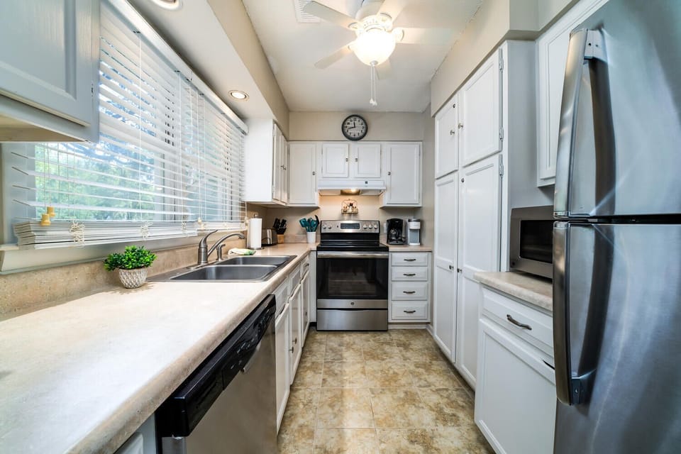 The kitchen has stainless appliances