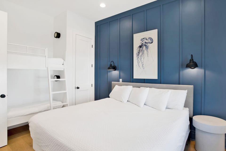 Bedroom 7 has a King bed, Twin bunk bed, TV and private bathroom