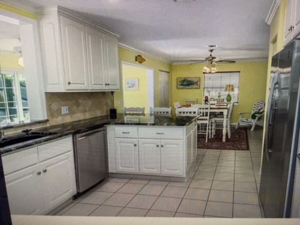 Meals can be served in the kitchen or the sunroom  - spacious seating