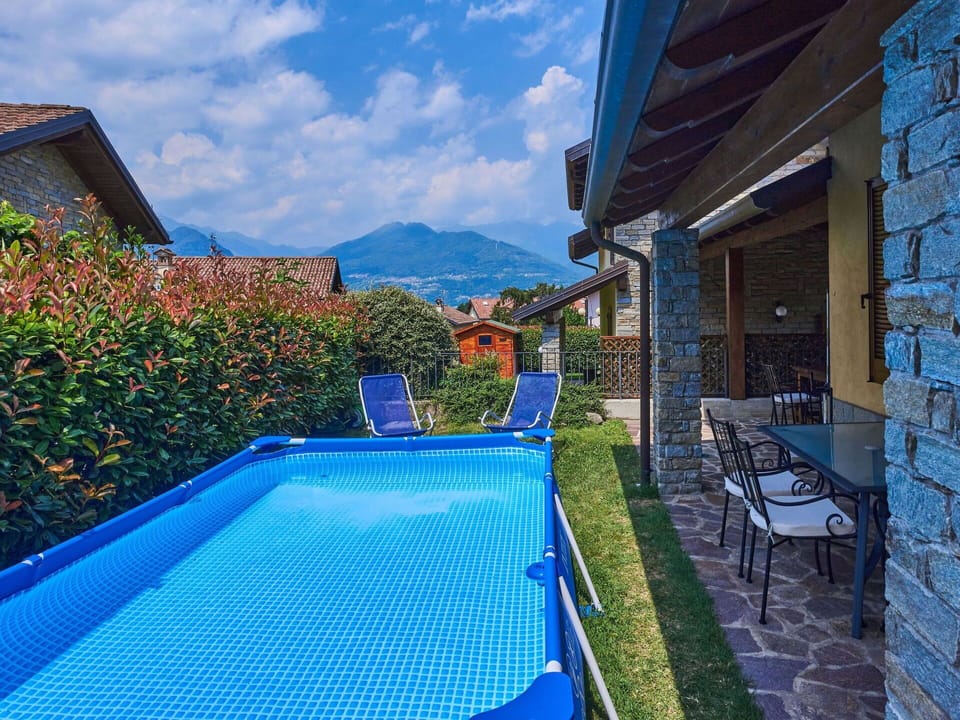 Sky, Plant, Water, Furniture, Cloud, Property, Building, Swimming Pool, Blue, Chair