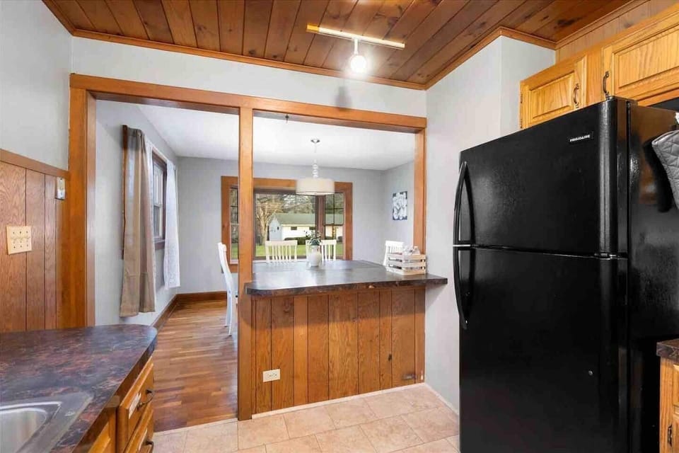 Functional kitchen layout with a breakfast bar and seamless flow into the dining space