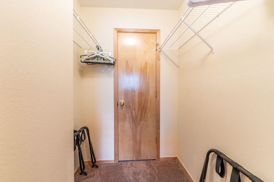 Primary bedroom walk-in closet.