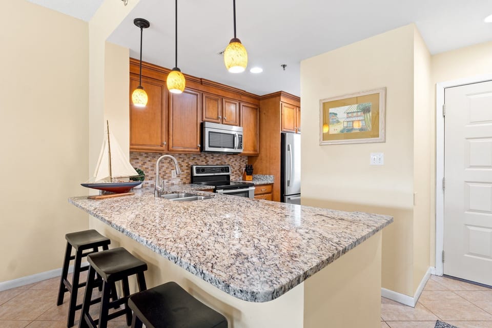 Granite counters with Double sink, disposal, microwave, coffee pot, blender, toaster, can opener and a double oven/range.

Professionally Managed by
Breathe Easy Rentals