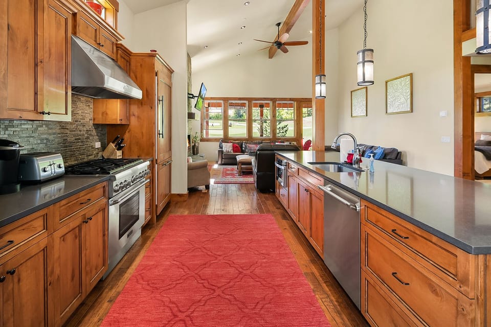 Elk Grove: - Granite kitchen with a large gas cooktop.