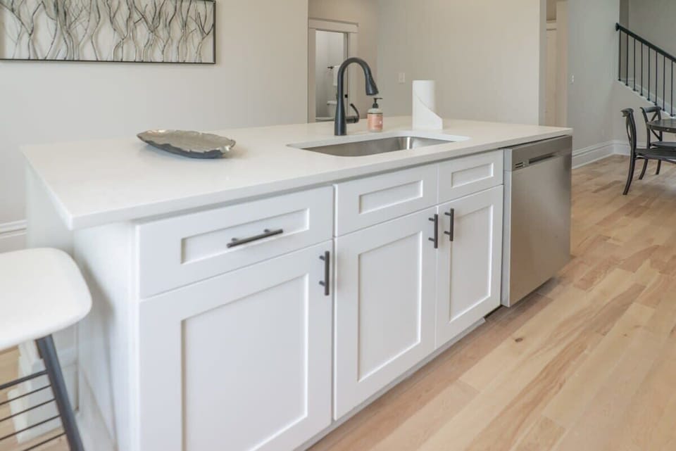 Kitchen island with Quartz Counter top and dishwasher for easy clean up!