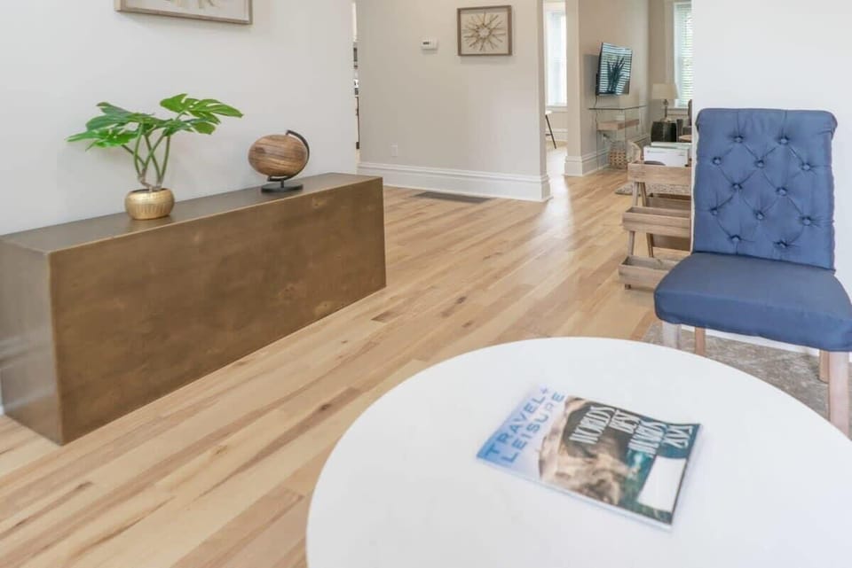 View of the entry way, and a sneak peak of the living area and kitchen with so much natural light