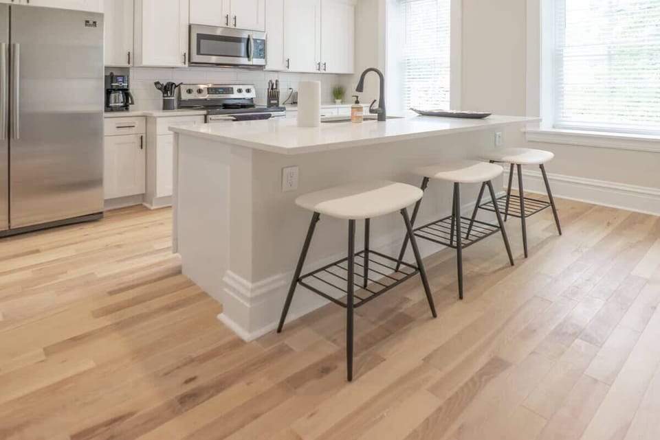 Fully Stocked Kitchen with additional seating. Take a seat and enjoy your chefs meals and conversations