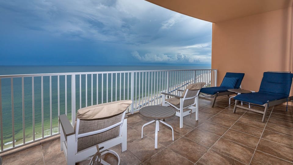 Breathe in the fresh air while lounging on the balcony, soaking in the tranquil beach views all around you