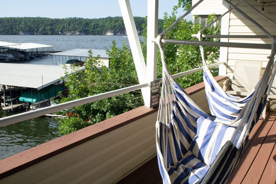 Private deck off the bedrooms with hammock chair swings to hang around!