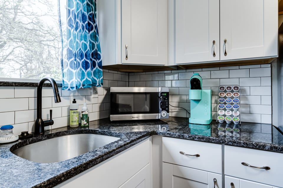 Stocked kitchen with Keurig, microwave, electric kettle, blender & toaster