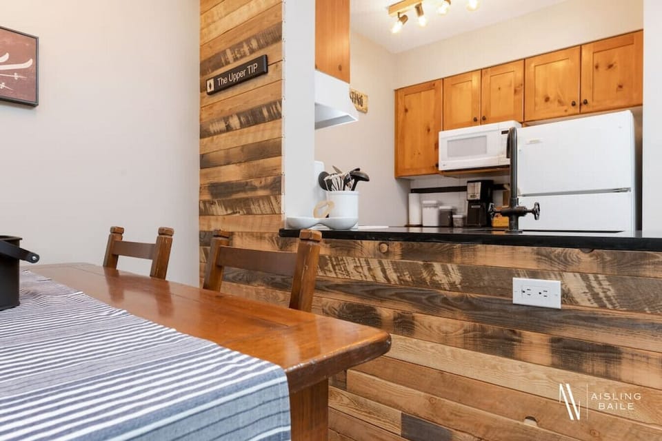 Full kitchen with a drip coffee machine, ground coffee, tea and sugar.