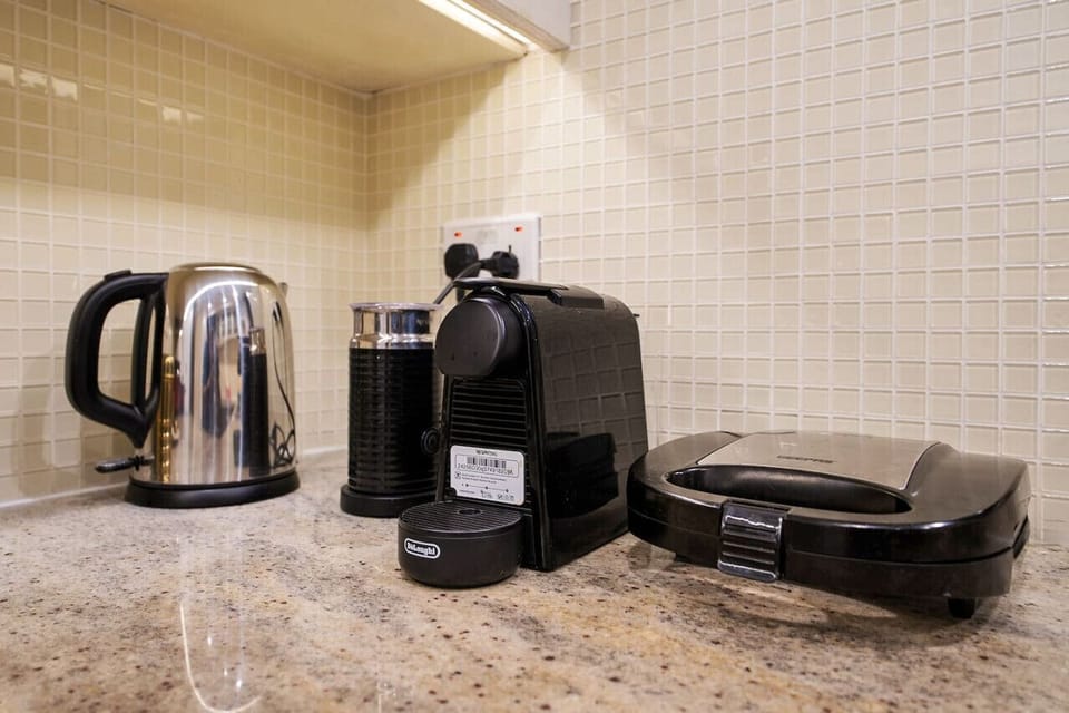 Kitchen Delights: Brew your favorite coffee and whip up meals in a fully equipped kitchen!
