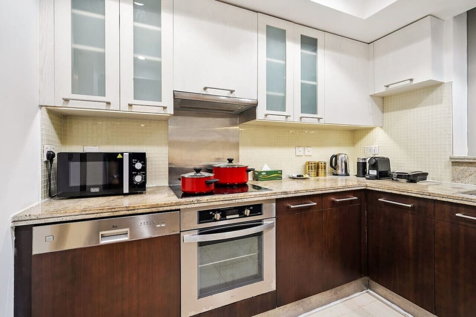Kitchen: Whip up culinary delights in this modern kitchen with sleek appliances and stylish decor!