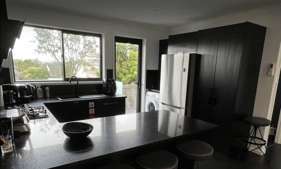 kitchen with grill, coffee machine, toaster, kettle, air fryer and lot of  other