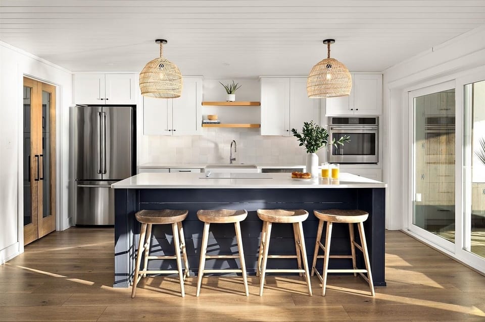 Gourmet kitchen with island seating and ocean views
