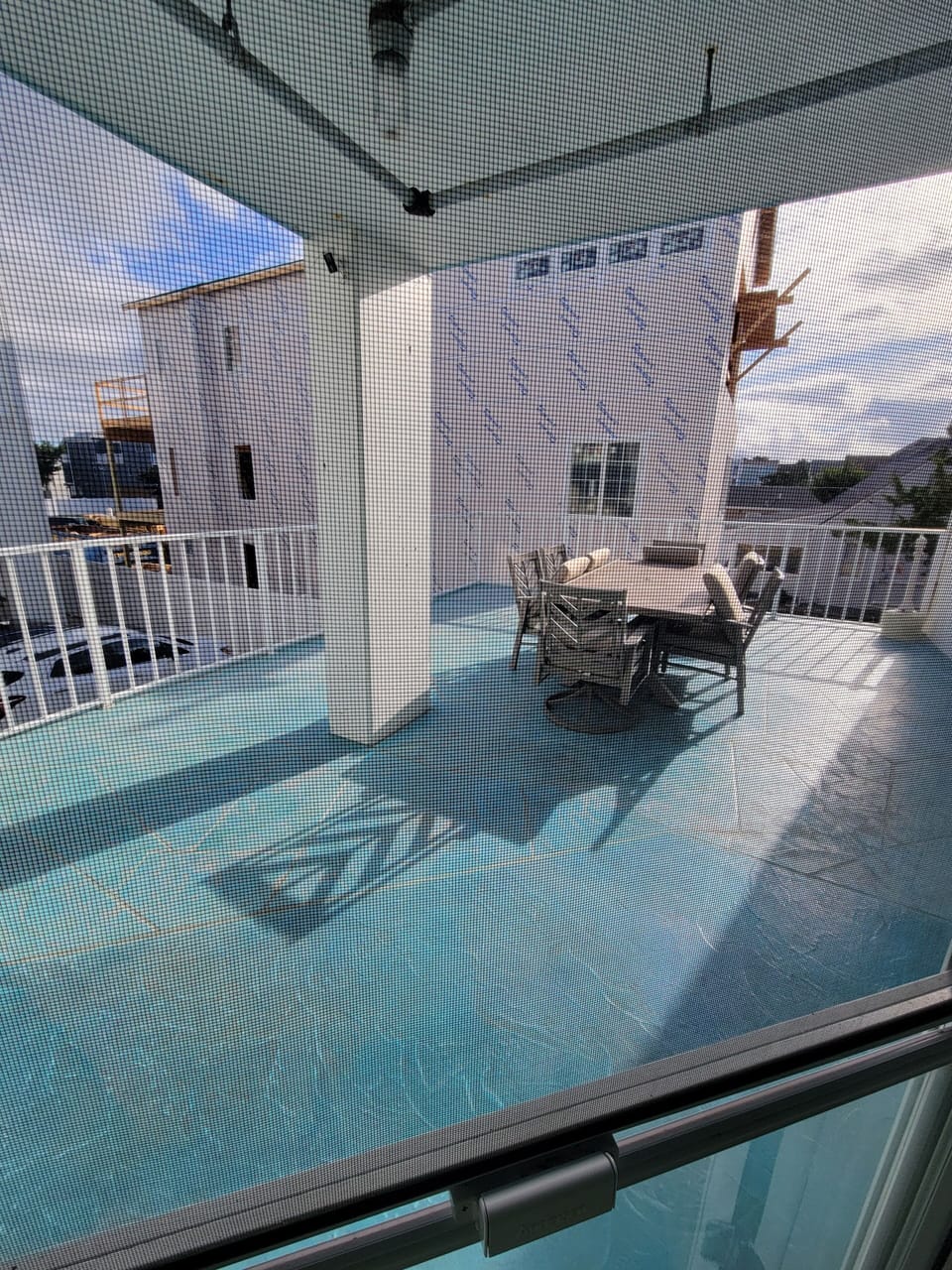Patio table with seating for 6 outside my front door. Sunbathe here too!