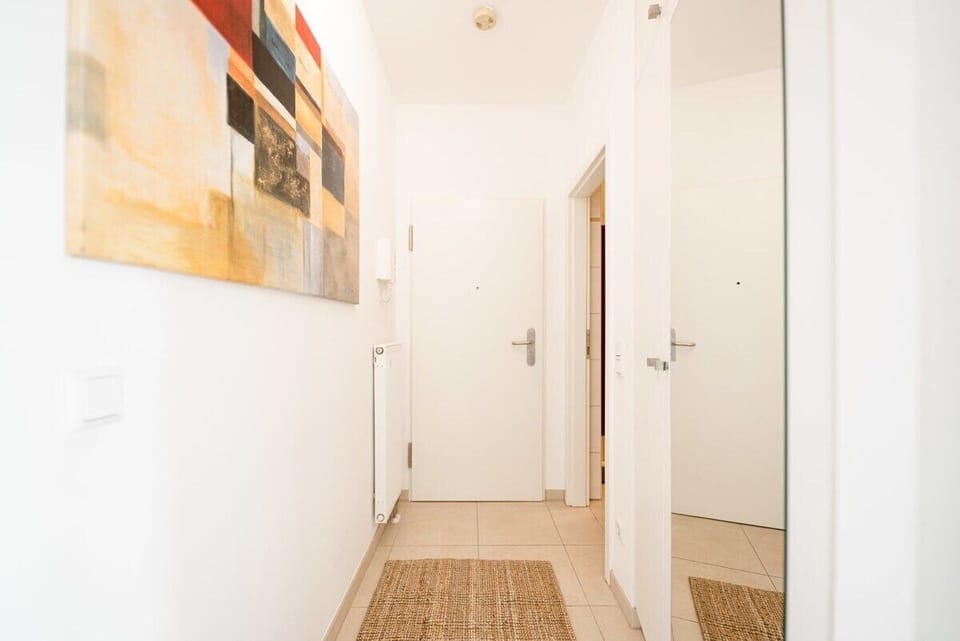Minimalist design for a spacious feel—hallways that lead to tranquil spaces.
