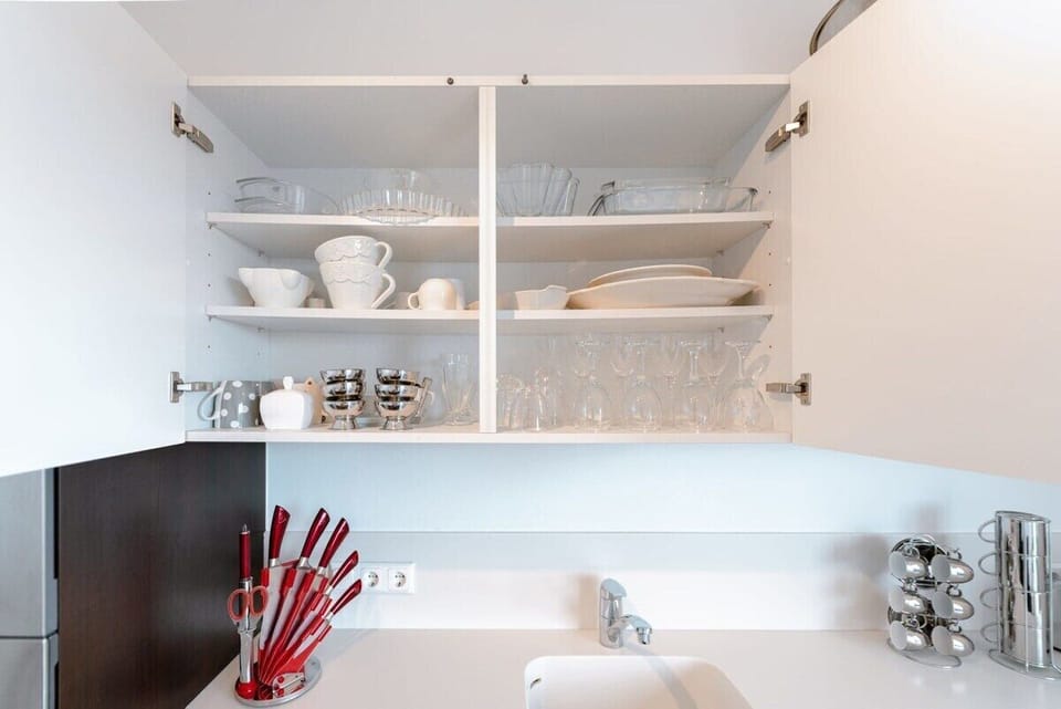 Our kitchen cabinets: stocked with essentials for your dining pleasure.