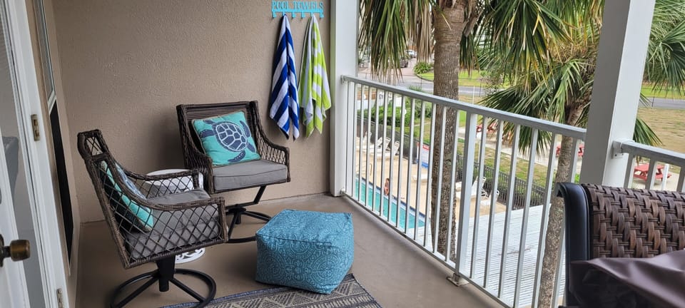 Relaxing chairs w/ foot poof and towel hooks for wet towels.