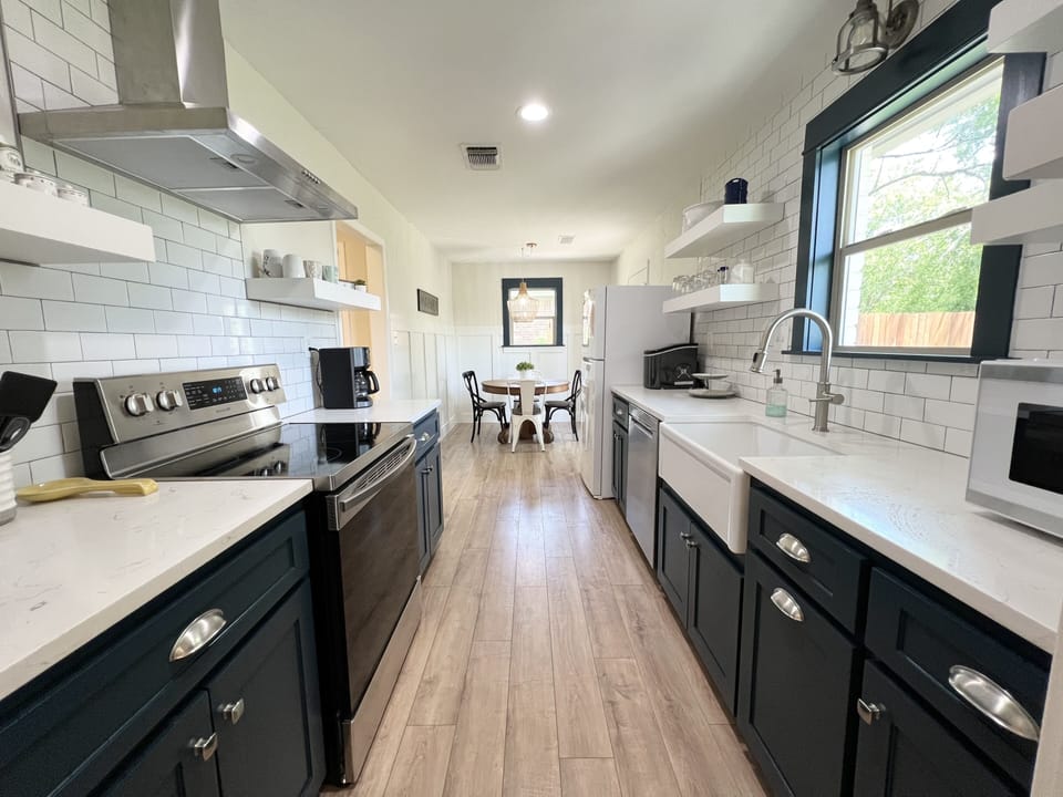 Fresh, clean & fully stocked kitchen.  Light & bright