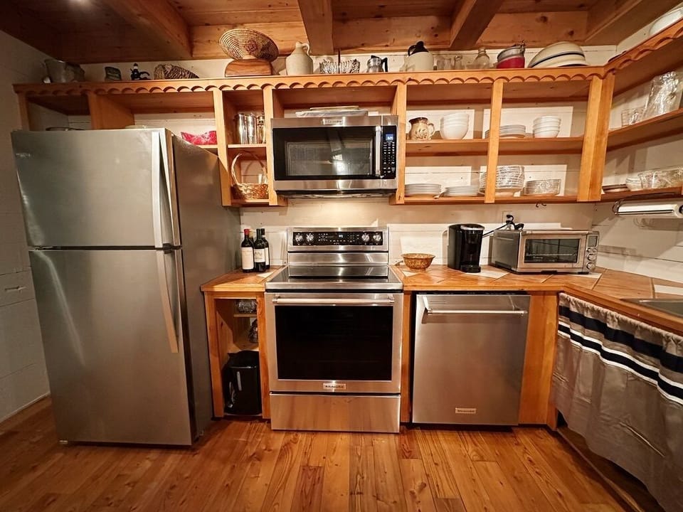 Well-equipped kitchen with new appliances and ocean views.