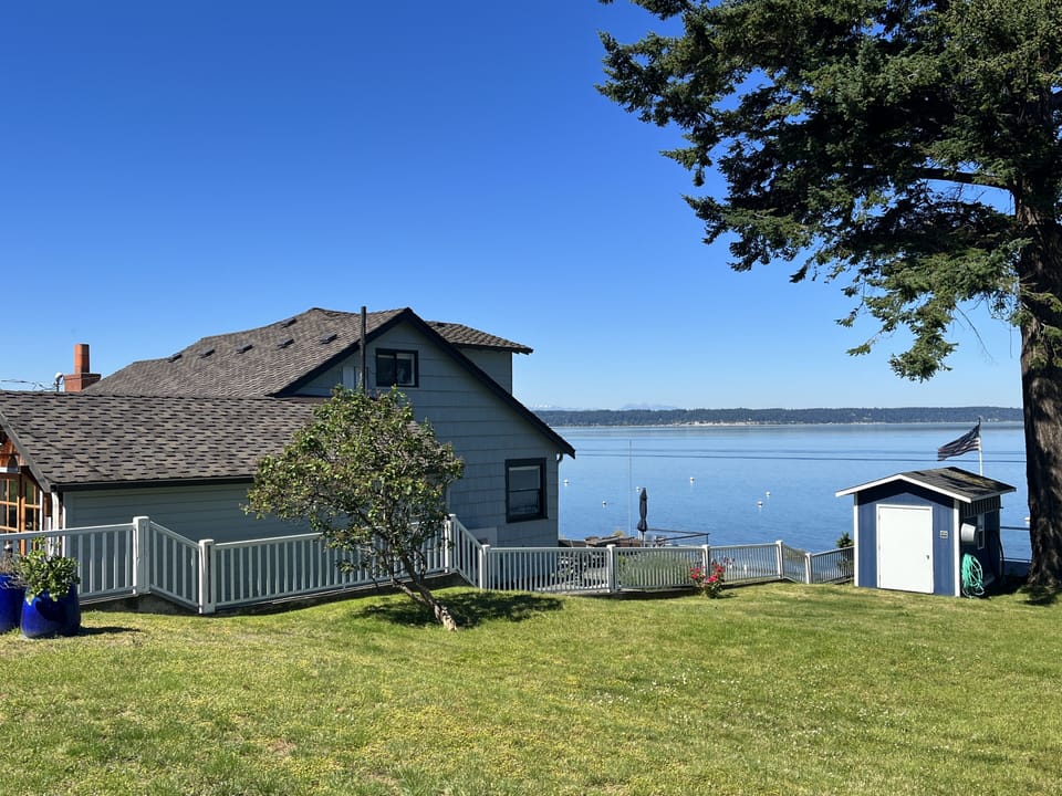 Our beautiful beach house perched right on Madrona beach