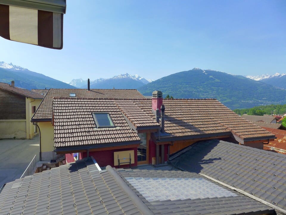 Sky, Building, Property, Window, Mountain, Wood, House, Slope, Urban Design, Mountain Range