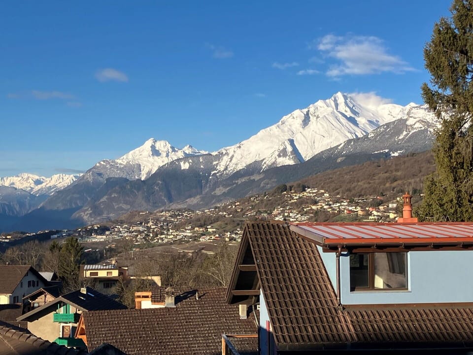 Sky, Cloud, Mountain, Snow, Building, Highland, Window, Slope, Tree, Landscape
