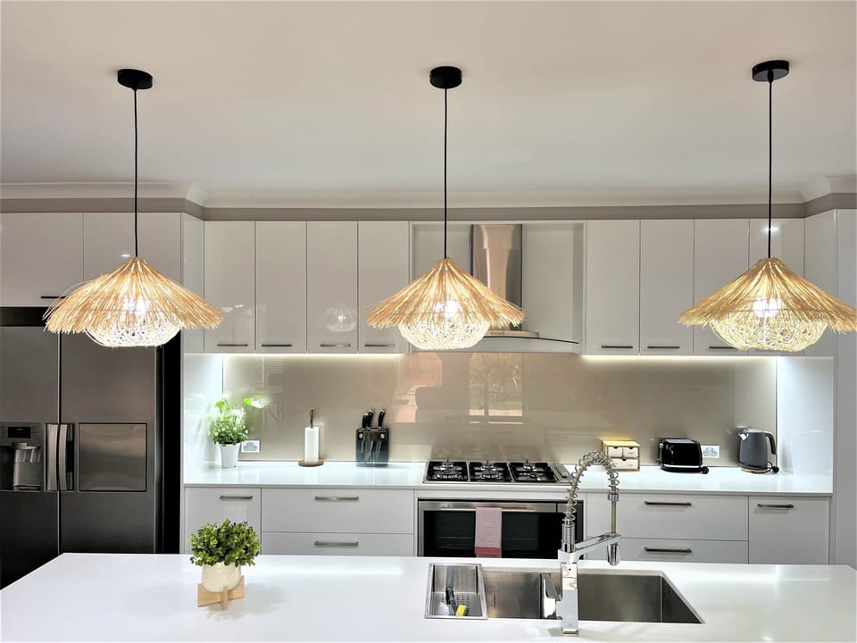 Modern bamboo pendant light over kitchen bench top