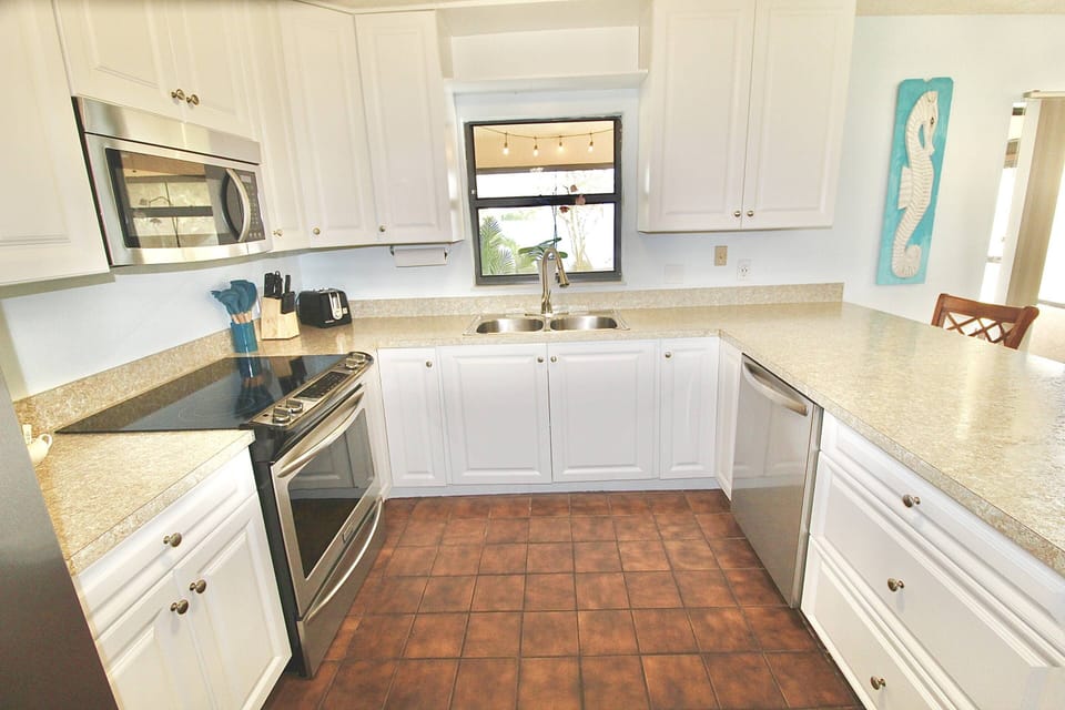 Newly remodeled kitchen with stainless steel appliances.