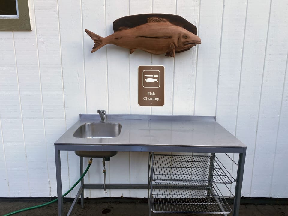 The house is equipped with an outdoor fish cleaning station for guest use.