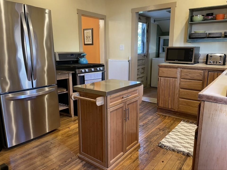 Well equipped kitchen adjacent to dining room and laundry.