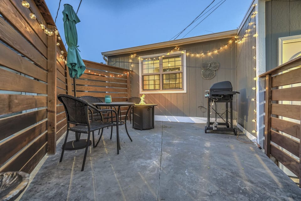 Cute front yard with a fire pit, grill, table and chairs!