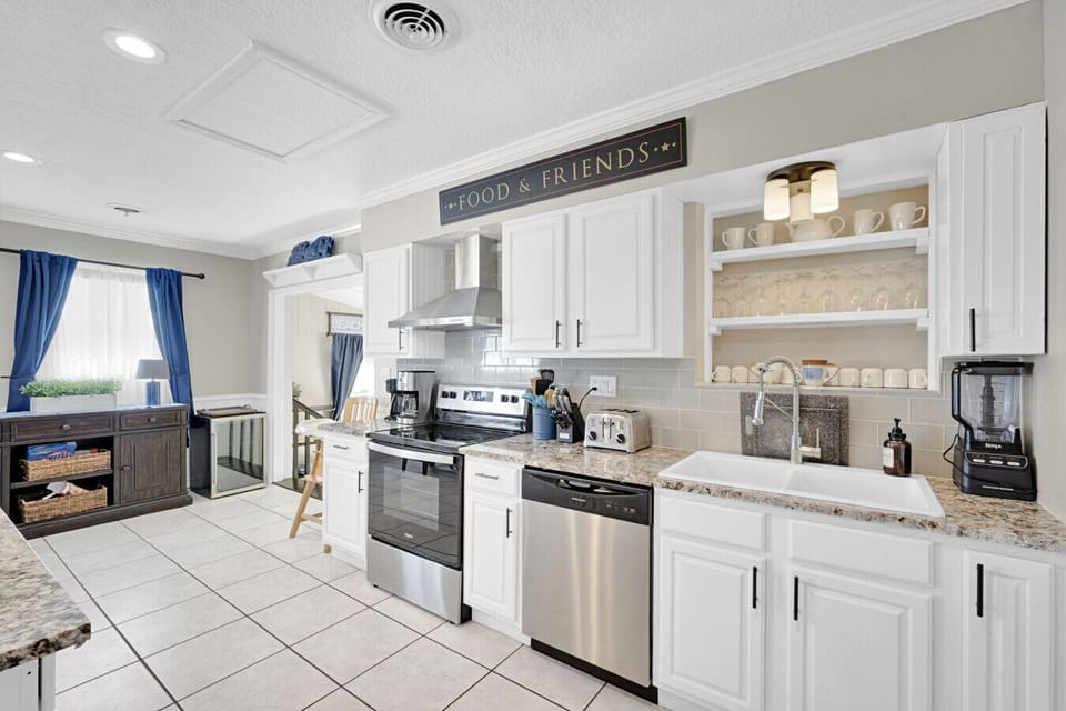 Kitchen with granite counter tops and stainless steel appliances.