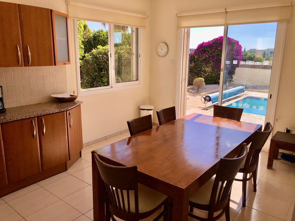 VIEW FROM KITCHEN OUT TO THE POOL